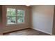 Spacious bedroom featuring a large window and wood-look floors at 1205 Bramlett Creek Pl, Lawrenceville, GA 30045