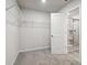 Spacious walk-in closet with wire shelving at 7739 Richmond Trl, Fairburn, GA 30213