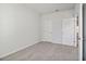 Bedroom with neutral walls and carpet flooring at 7739 Richmond Trl, Fairburn, GA 30213