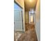 Hallway with carpet and access to multiple rooms at 3059 Woodward Down Trl, Buford, GA 30519