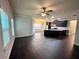 Spacious living room with dark hardwood floors and open floor plan at 3059 Woodward Down Trl, Buford, GA 30519