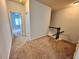 Upstairs hallway with carpet and access to bedrooms at 3059 Woodward Down Trl, Buford, GA 30519
