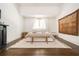 Spacious bedroom with hardwood floors, king bed, and large windows at 234 E Main St, Rutledge, GA 30663