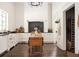 Spacious kitchen with white cabinets, dark hardwood floors, and high-end appliances at 234 E Main St, Rutledge, GA 30663