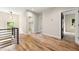 Upstairs hallway with hardwood floors and access to bedrooms at 1962 Compton Se Dr, Atlanta, GA 30315