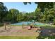 playground with swings and play structure near tennis courts at 6 Walnut Hill Nw Pl, Atlanta, GA 30318