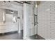 Modern bathroom with double vanity, subway tile shower, and hexagon floor tile at 878 Peachtree Ne St # 612, Atlanta, GA 30309