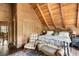 Large Primary bedroom with wood walls and a comfy bed at 7790 Atlanta Newnan Rd, Chattahoochee Hills, GA 30268