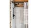 Walk-in shower with stone accent wall at 7790 Atlanta Newnan Rd, Chattahoochee Hills, GA 30268