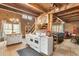 Rustic kitchen with exposed beams, island, and farmhouse charm at 7790 Atlanta Newnan Rd, Chattahoochee Hills, GA 30268
