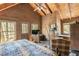 Primary bedroom with private access and wooded views at 7790 Atlanta Newnan Rd, Chattahoochee Hills, GA 30268
