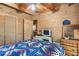 Spacious bedroom with wood walls and a comfortable bed at 7790 Atlanta Newnan Rd, Chattahoochee Hills, GA 30268