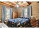 Charming bedroom with wood walls and a queen-size bed at 7790 Atlanta Newnan Rd, Chattahoochee Hills, GA 30268