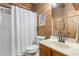 Clean bathroom with shower, toilet, and vanity at 7790 Atlanta Newnan Rd, Chattahoochee Hills, GA 30268