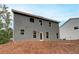 Gray two story house with multiple windows and a patio at 1097 Bodega Loop, Locust Grove, GA 30248