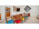 Spacious dining area with a long wooden table and colorful chairs at 2500 Peachtree Nw Rd # 405S, Atlanta, GA 30305