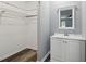 Well-appointed bathroom with vanity, mirror and closet at 3261 Harbor Woods Rd, Decatur, GA 30034