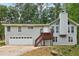 Gray two-story house with attached garage and wooden deck at 3261 Harbor Woods Rd, Decatur, GA 30034