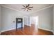 Living room with hardwood floors, fireplace, and access to other rooms at 115 Parson Ave, Bowdon, GA 30108