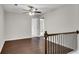 Spacious loft area with wood-look floors and ceiling fan at 4965 Whiteoak Se Walk # 19, Smyrna, GA 30080