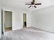 Spacious bedroom with ceiling fan and carpet flooring at 3742 Linecrest Rd, Ellenwood, GA 30294