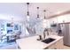 Modern kitchen with large island, stainless steel appliances, and white cabinetry at 2004 Fontainbleau Dr, Conyers, GA 30094
