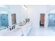 Elegant bathroom with double vanity, large mirror, and walk-in shower at 2004 Fontainbleau Dr, Conyers, GA 30094