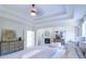 Bright bedroom featuring a cozy fireplace and sitting area at 2004 Fontainbleau Dr, Conyers, GA 30094