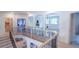 Bright upper hallway with wood flooring and a view of bedrooms at 2004 Fontainbleau Dr, Conyers, GA 30094