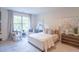 Bright bedroom with a queen-size bed and large window at 2004 Fontainbleau Dr, Conyers, GA 30094