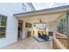 Covered deck with ceiling fan and outdoor seating area at 2004 Fontainbleau Dr, Conyers, GA 30094