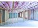 Unfinished basement with framed walls and pink insulation at 2004 Fontainbleau Dr, Conyers, GA 30094