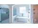 Luxurious bathroom with soaking tub and walk-in shower at 2004 Fontainbleau Dr, Conyers, GA 30094