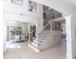 Grand two story entryway with open staircase and hardwood floors at 2004 Fontainbleau Dr, Conyers, GA 30094