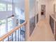 Upstairs hallway overlooking the living room with iron railings at 2004 Fontainbleau Dr, Conyers, GA 30094