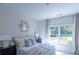 Bedroom with a queen bed, large window and neutral decor at 2004 Fontainbleau Dr, Conyers, GA 30094