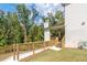 Steps down to a spacious backyard deck with wooded views at 2004 Fontainbleau Dr, Conyers, GA 30094