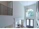 Elegant two-story foyer with a grand window and chandelier at 2004 Fontainbleau Dr, Conyers, GA 30094