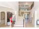 Grand two story entry with open staircase and wood floors at 2004 Fontainbleau Dr, Conyers, GA 30094