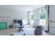 Bright home office with glass desk, comfortable chairs and large windows at 2004 Fontainbleau Dr, Conyers, GA 30094