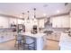 Modern kitchen featuring white cabinets, large island, and stainless steel appliances at 2004 Fontainbleau Dr, Conyers, GA 30094