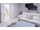 Finished basement with comfortable seating and a large artwork at 2004 Fontainbleau Dr, Conyers, GA 30094