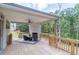 Spacious covered deck with wood flooring and wooded views at 2004 Fontainbleau Dr, Conyers, GA 30094
