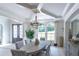 Elegant dining room with oval table, chandelier, and large windows at 2004 Fontainbleau Dr, Conyers, GA 30094