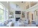 Two story Gathering room with fireplace, built-ins and hardwood floors at 2004 Fontainbleau Dr, Conyers, GA 30094