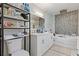 Bathroom with double vanity, soaking tub, and separate shower at 3636 Evans Rd, Atlanta, GA 30340