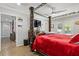 Spacious main bedroom with a four-poster bed and access to a private patio at 3636 Evans Rd, Atlanta, GA 30340