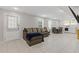 Finished basement with a sectional sofa, dining area, and laundry at 3636 Evans Rd, Atlanta, GA 30340