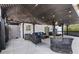 Covered patio with seating area, string lights, and outdoor shower at 3636 Evans Rd, Atlanta, GA 30340