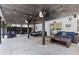 Covered patio with seating area, string lights, and outdoor speakers at 3636 Evans Rd, Atlanta, GA 30340